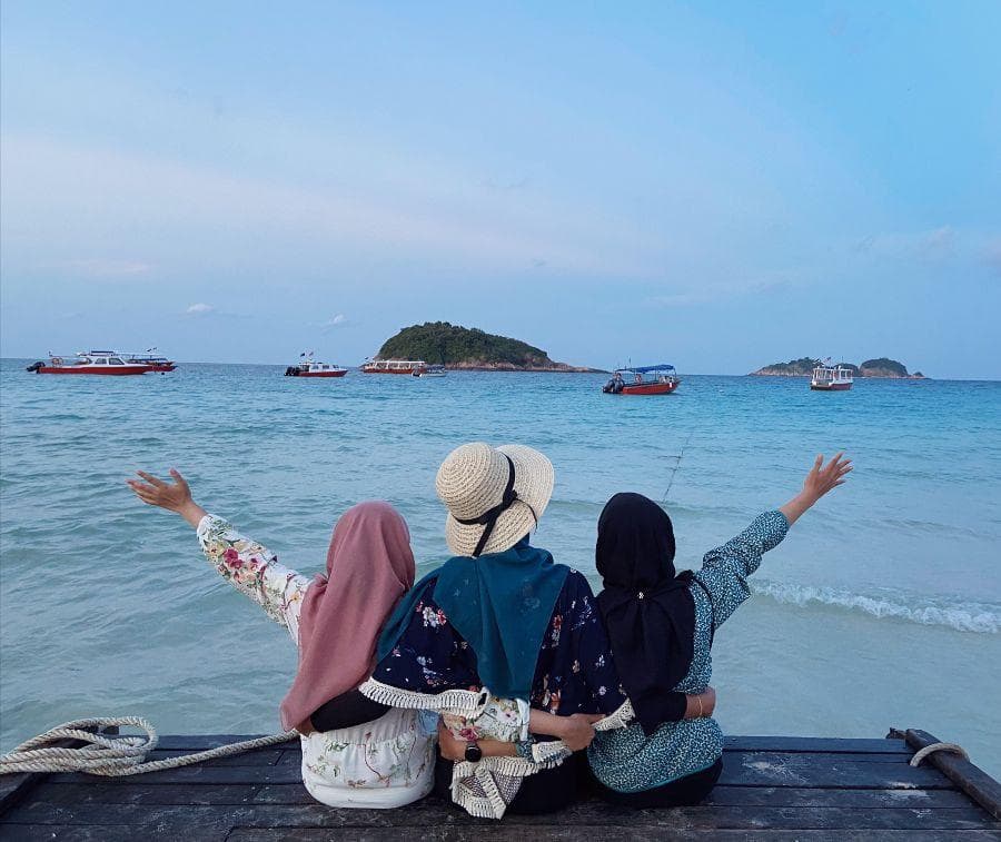 Women enjoying a group holiday by the sea